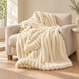 Alabaster Halo bubble faux-fur throw on an oatmeal linen armchair. AI-styled scene based on supplier photography; colour and texture pending sample verification.